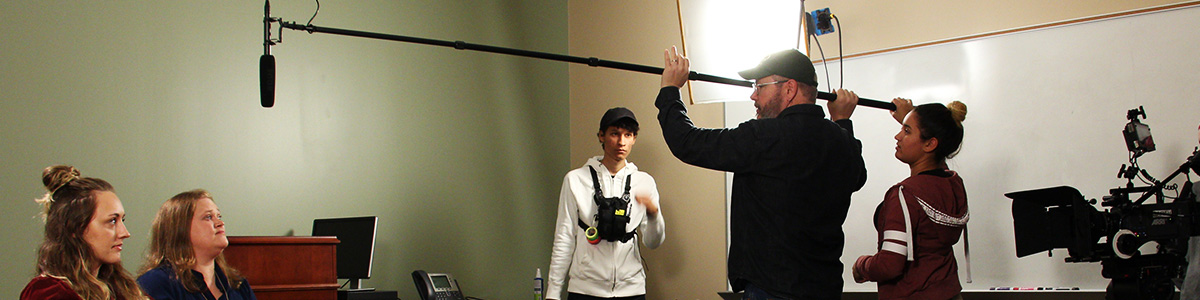 film crew working on equipment