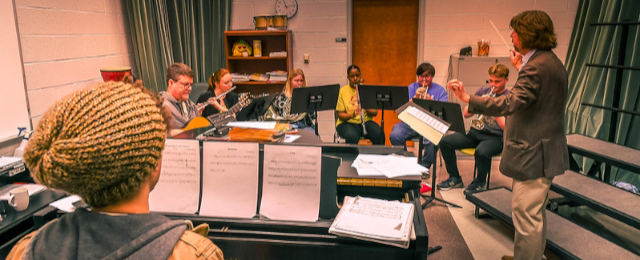 Instrumental ensemble practicing in a classroom