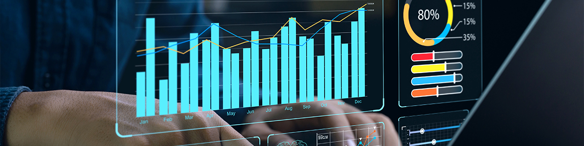 Hands typing on a laptop with a transparent analytics dashboard showing bar charts, gauges, and progress bars.