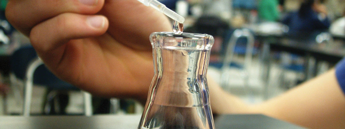 dripping liquid into a beaker
