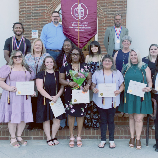 Alpha Sigma Lambda students on steps