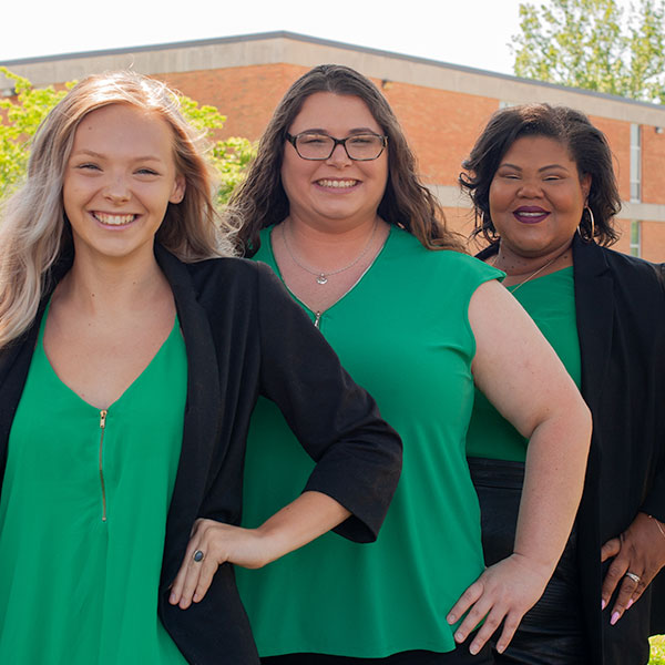 3 students wearing green
