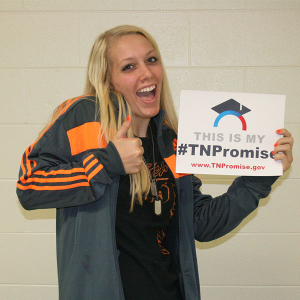 excited student with TN Promise sign