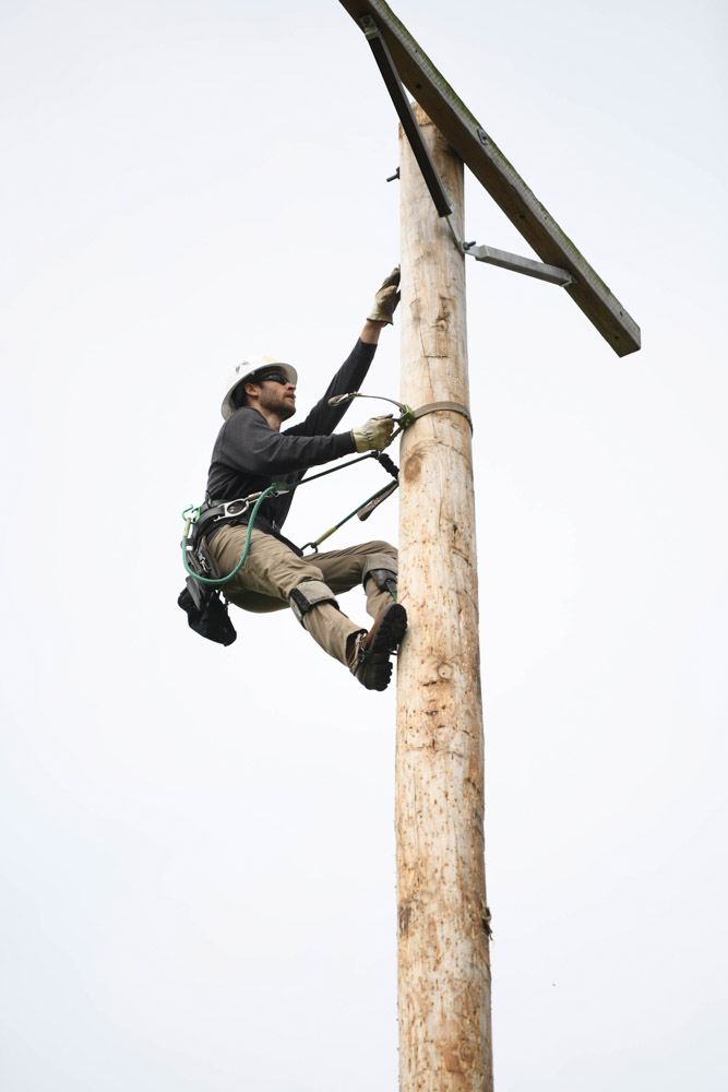 Gavin Rector from Thompson’s Station completes the 80-foot pole climb..jpg