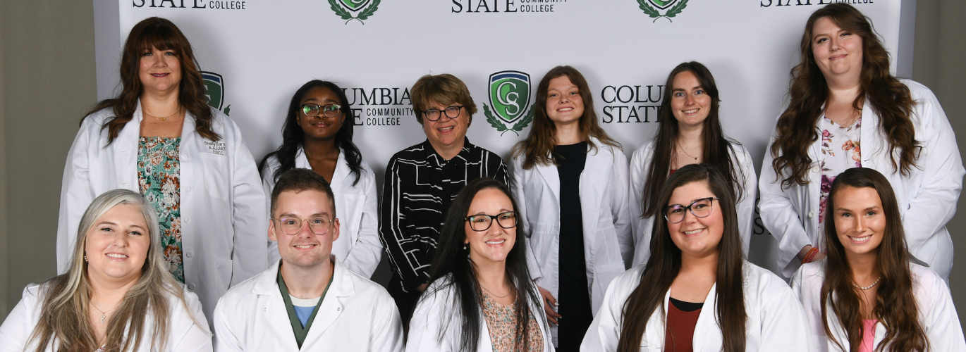 Columbia State Community College’s Spring 2024 medical laboratory technician graduates. Pictured (standing, left to right): Shelly Barron; Abreonna Jenkins; Lisa Harmon, Columbia State program director and assistant professor of medical laboratory technology; Sara Strickroot; Shawna Veltri and Paige Hull. Sitting (left to right): Caitlin Farrar, Noah Wright, Jessica Perry, Peyton Anderson and Bailee Dale.