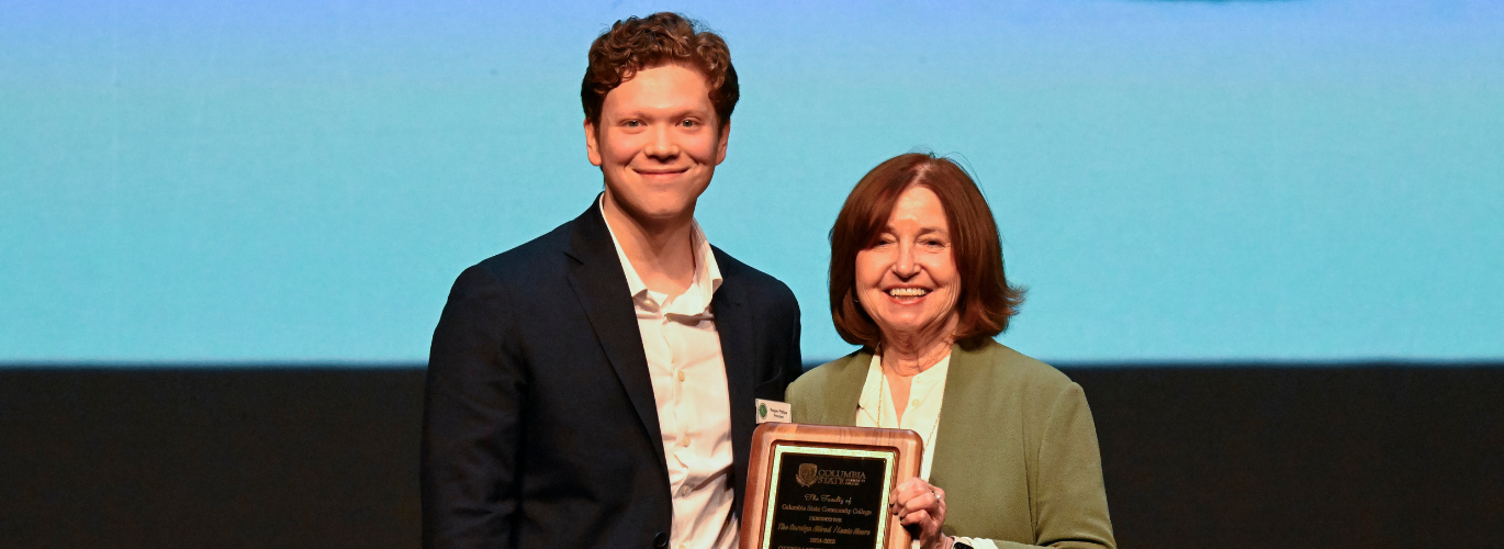 Reagan Phillips receives the received the Carolyn Allred/Lewis Moore Outstanding Student Award.