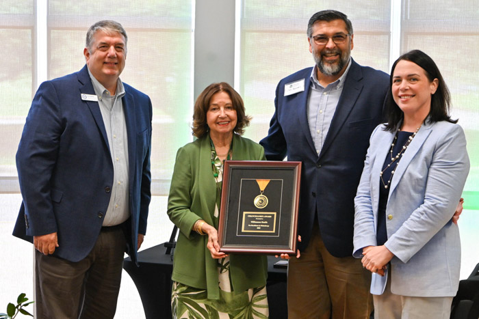 Dr. Janet F. Smith, Columbia State president, presents the Chancellor’s Award for Excellence in Philanthropy to Williamson Health. Pictured (left to right): Cris Perkins, associate vice chancellor of strategic advancement for the College System of Tennessee; Smith; Jim Hughes, Williamson Health director of organizational development; and Liz Mac, Williamson Health associate chief nursing officer. 