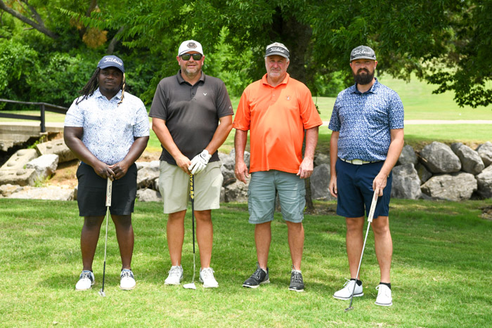 Pictured (left to right): First flight, first place winners, PJ Allen, David Robinson, Vic Wolaver and Lucas Laster.